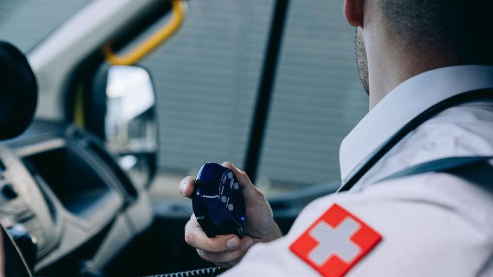paramedic holding a radio