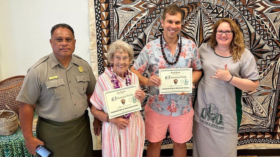 Grandma and grandson receiving certificate for visiting 63 U.S. National Parks