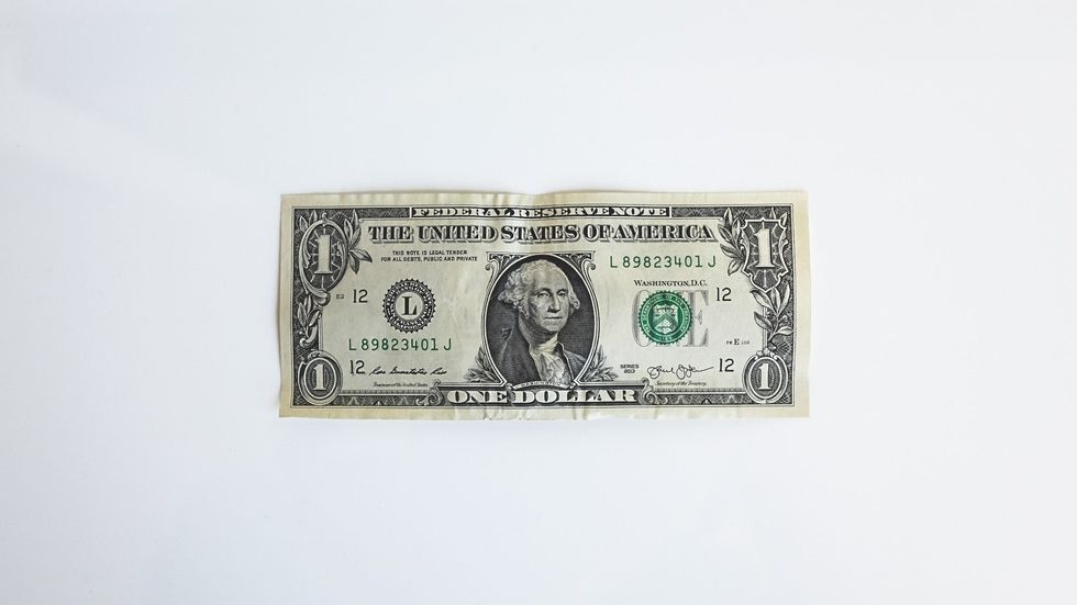 a dollar bill on a white background