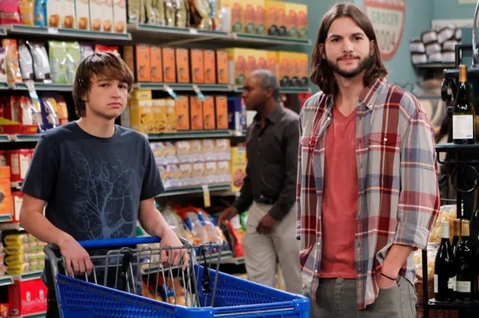 Still of Angus T Jones and Ashton Kutcher on Two and a half men