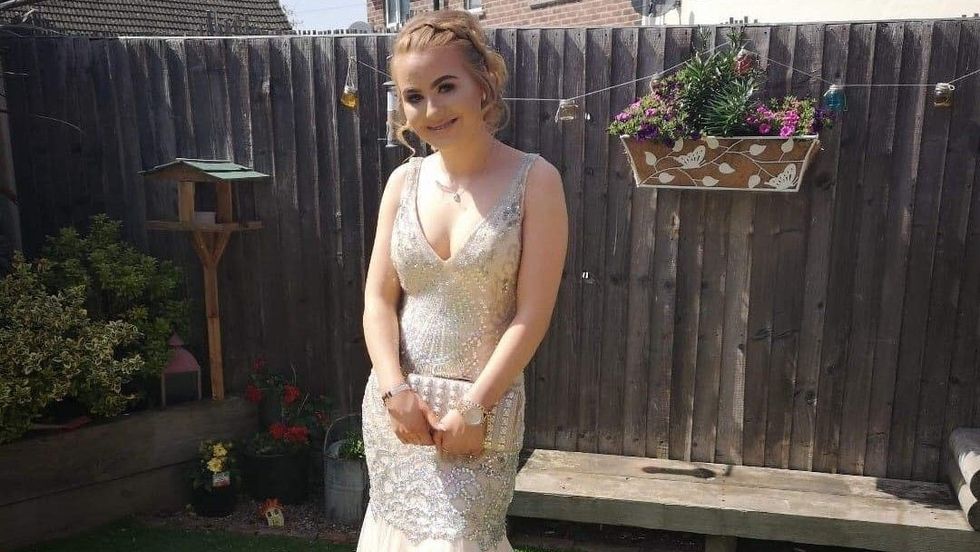 teen girl wearing a prom dress
