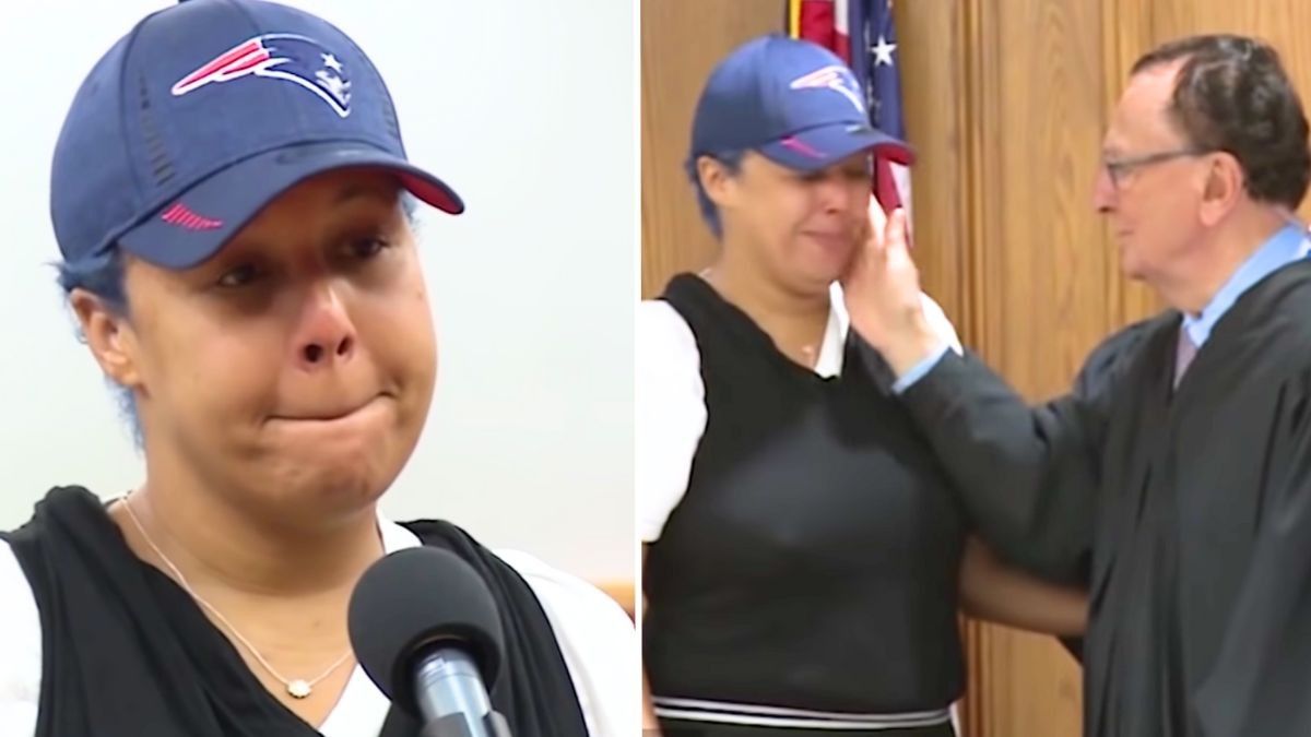 woman wearing a cap and a judge comforting a crying woman