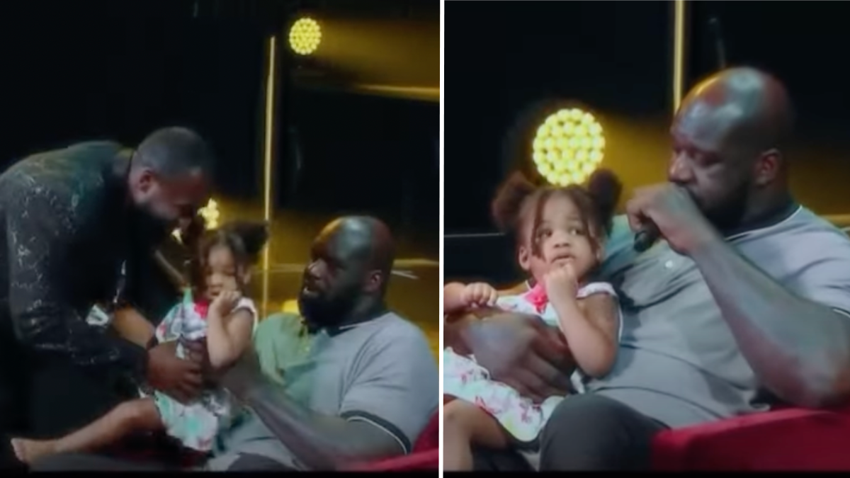 Shaq with a little girl on his lap