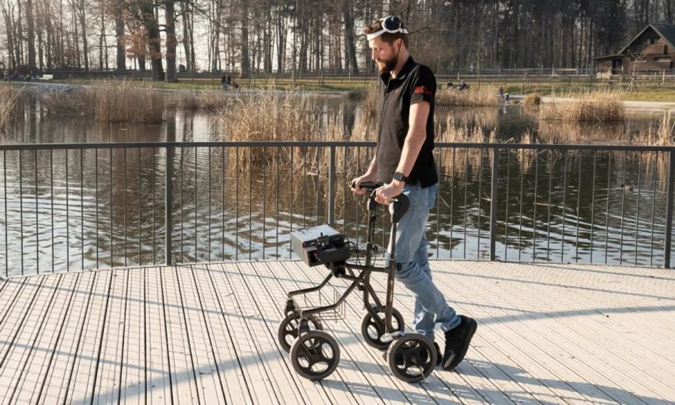 paralyzed man walk again AI bluetooth technology