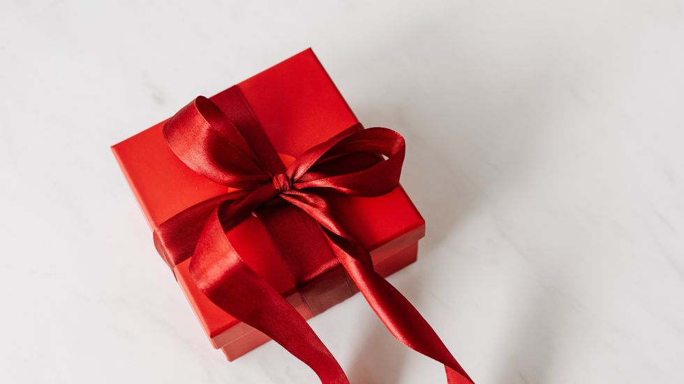a gift wrapped in red