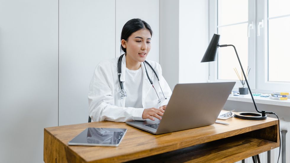 female doctor working on a laptop
