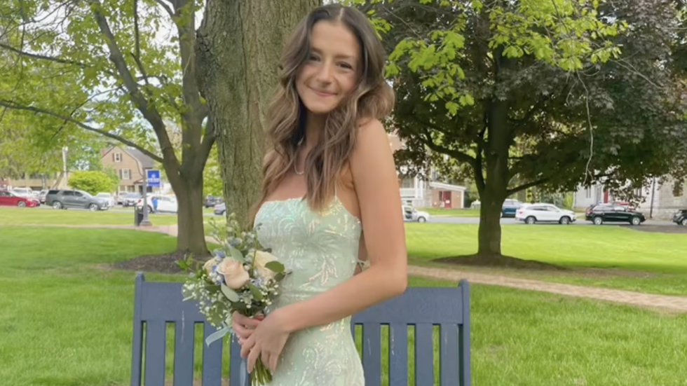 teen girl wearing beautiful prom dress