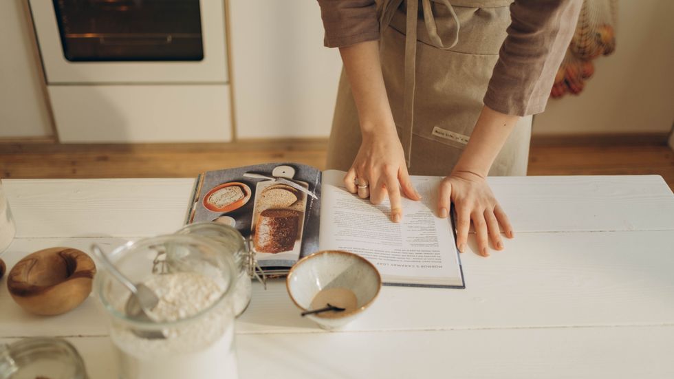 person reading a cook book