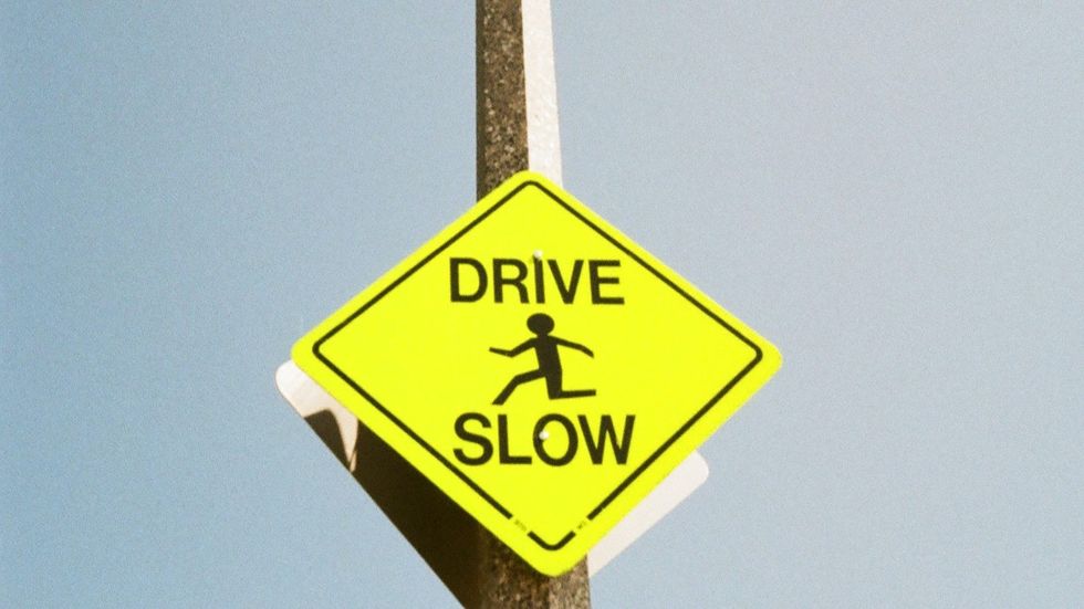 "drive slow" sign