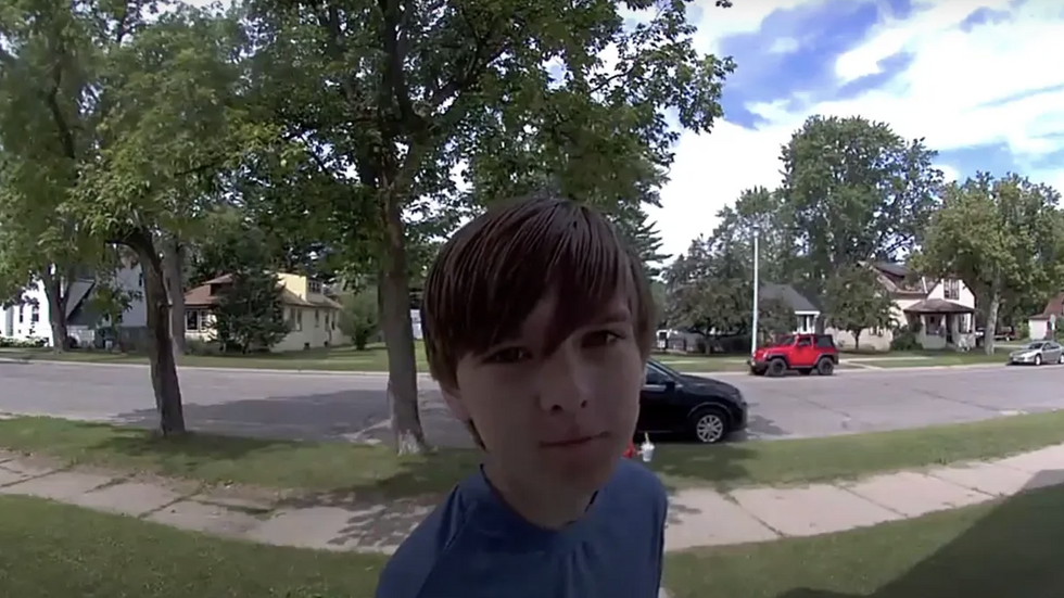 teen leaving a message on doorbell camera