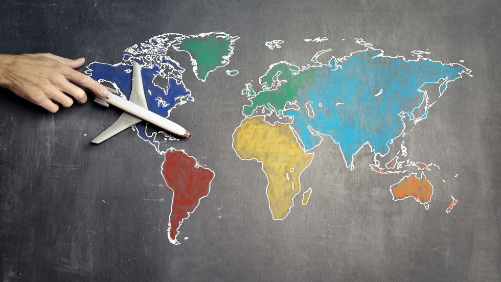toy airplane on a world map