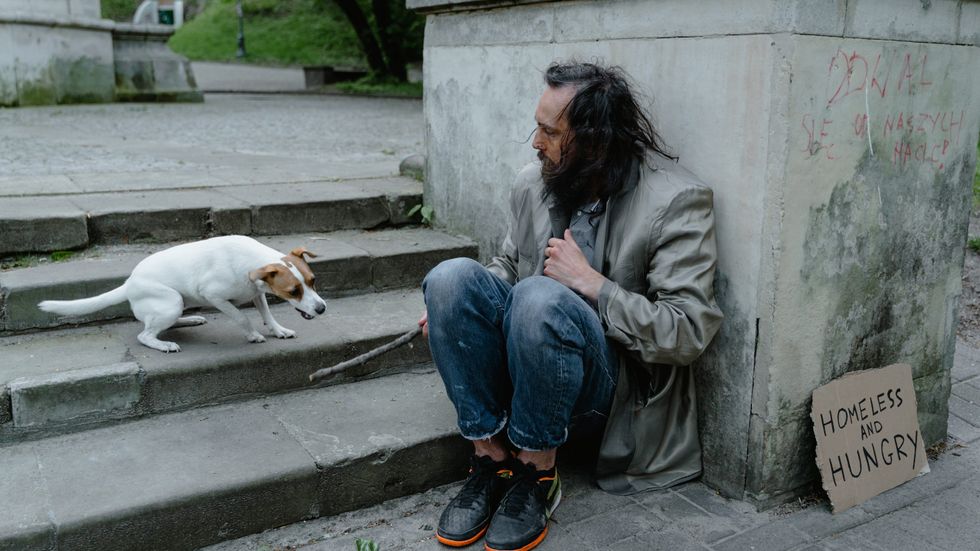 homeless man with a dog