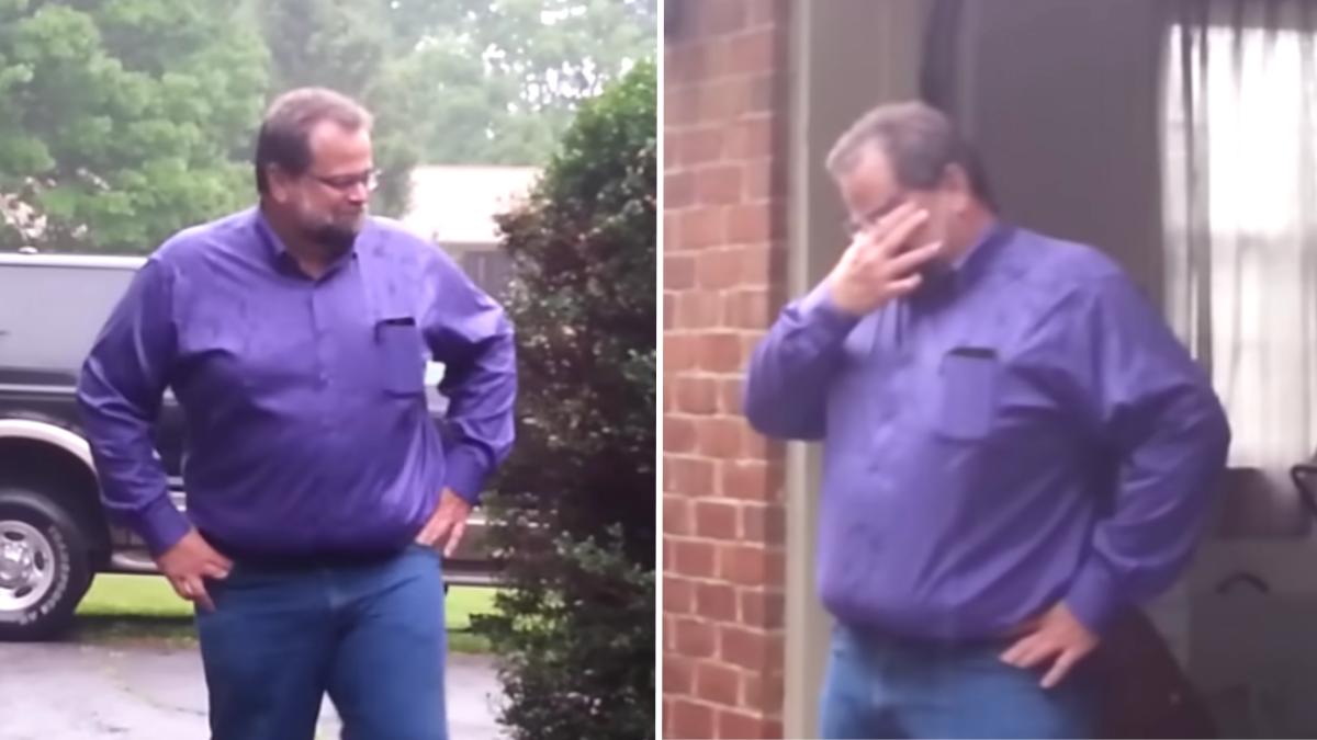 man in a purple shirt crying