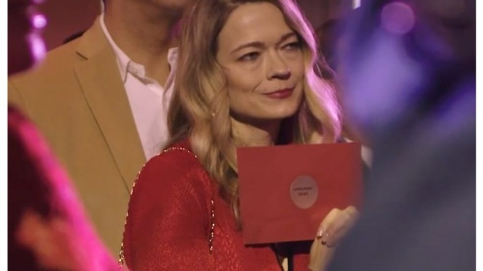 woman holding a red envelope