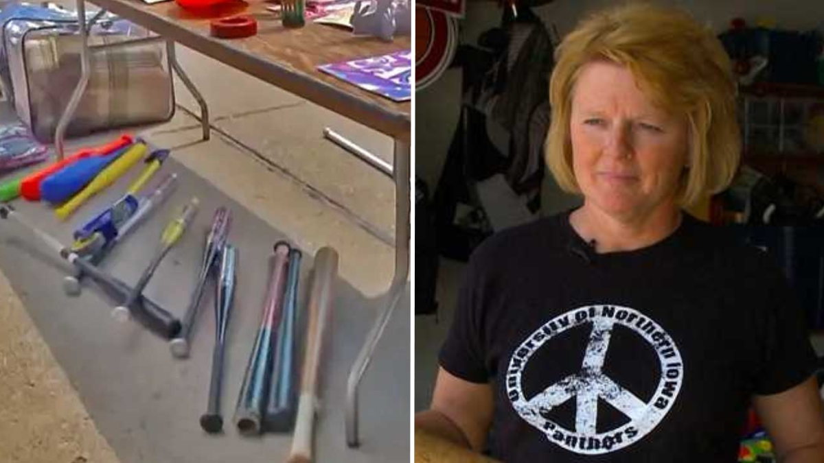 garage sale items kept under a table and a woman wearing a black tshirt with a peace symbol on it
