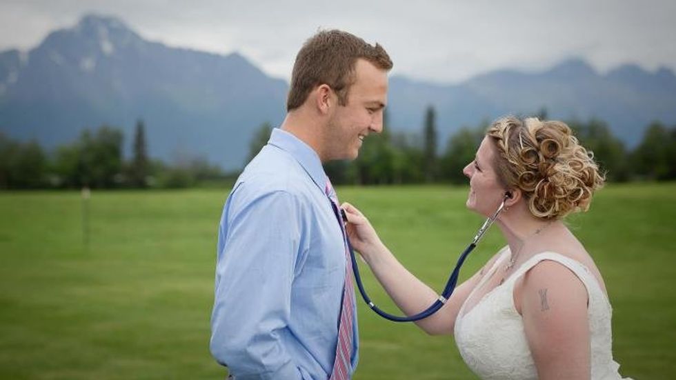 bride using a stethoscope on a man