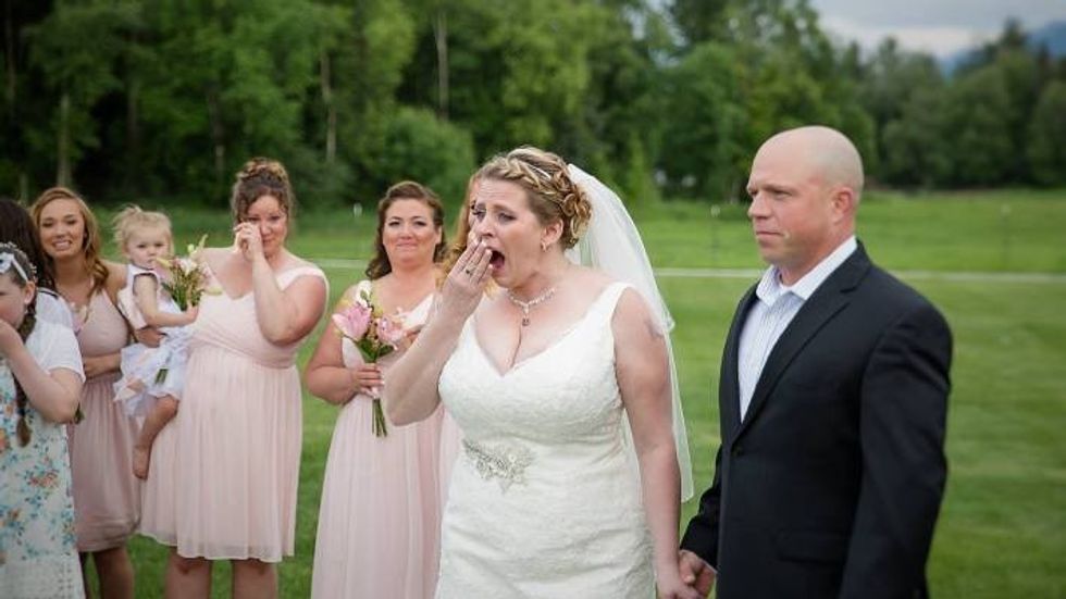 bride looking surprised at her wedding