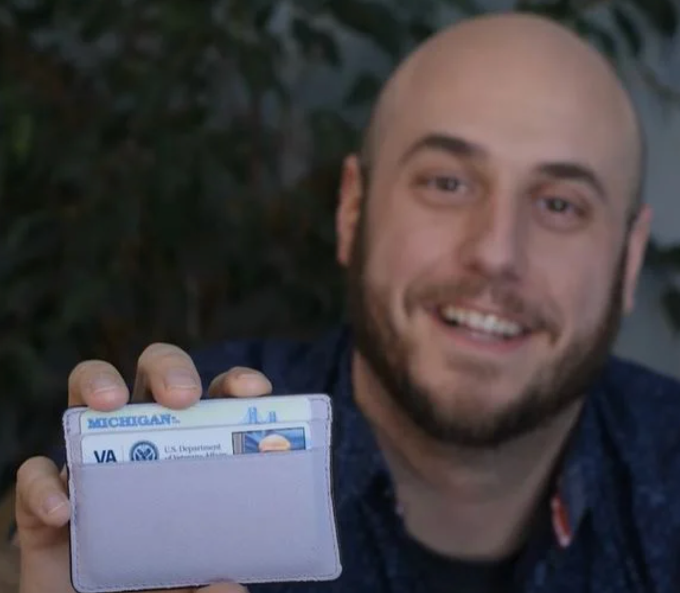 man holding his wallet