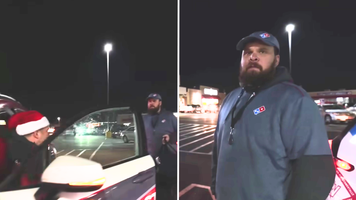 man delivering pizzas in a parking lot