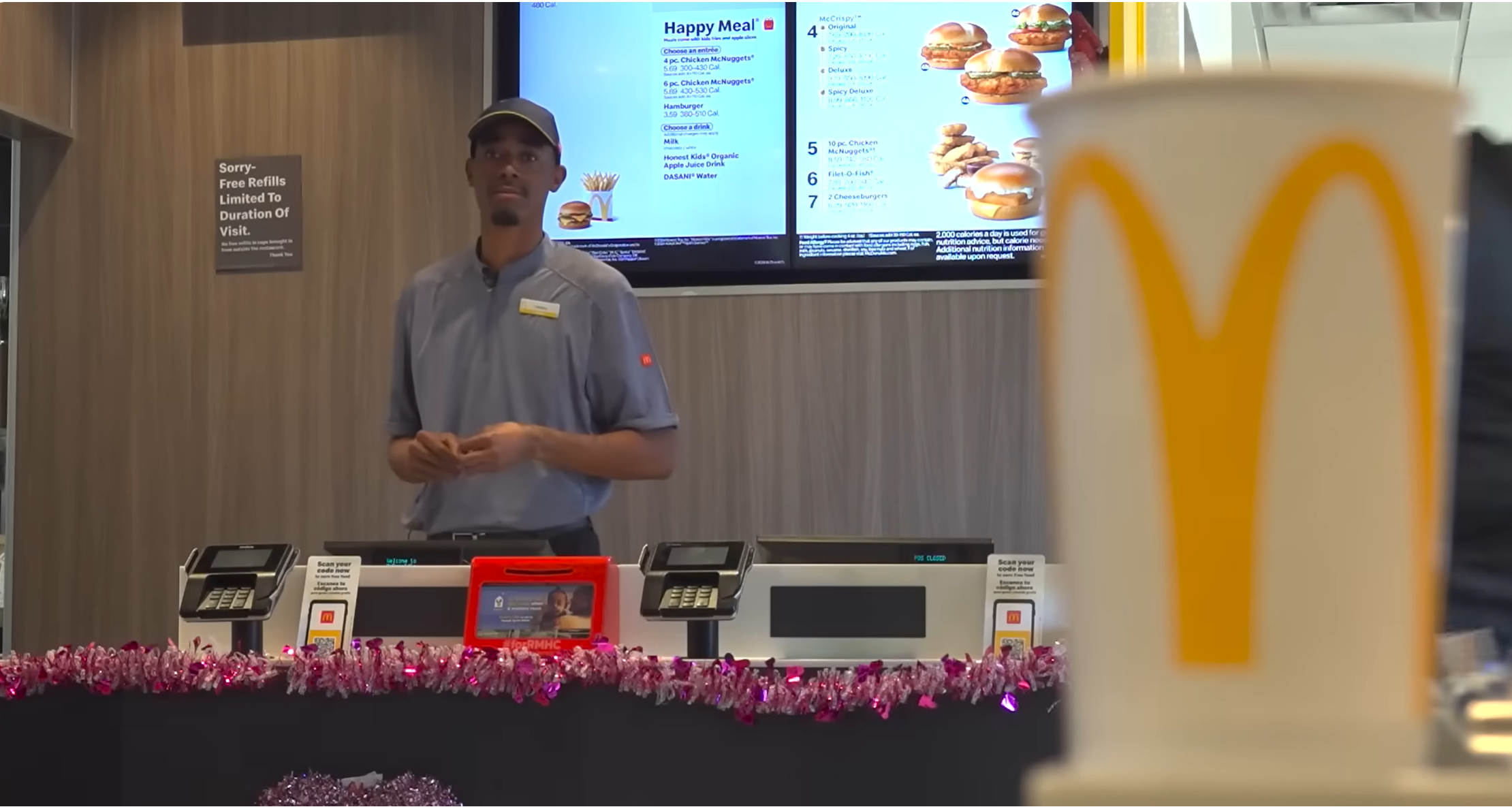 McDonalds employee standing behind counter