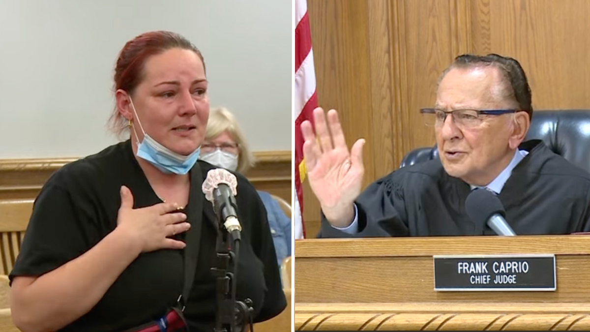 woman standing in a courtroom and a judge speaking to the woman